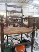 A carver chair with slat back and rush seat