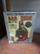 A vintage boxed Tasco 750 microscope