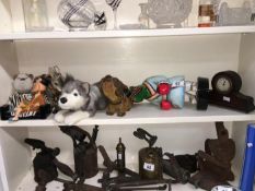 A shelf of interesting items including mantel clock