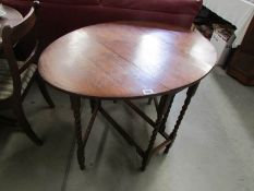 An oak barley twist gate leg table