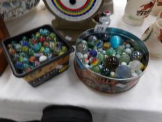2 tubs of marbles