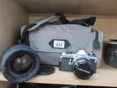 A Pentax SLR 35 mm camera with lenses etc