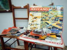 A box set of Meccano with magazines & motor