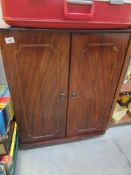 A mahogany effect TV cabinet