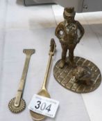 A brass figure and 2 brass pastry wheels