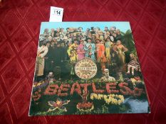 The Beatles Sgt Peppers Lonely Hearts Club Band with cutouts, G + L gatefold,