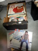 A mixed lot of LP's, 45rpm's & 12 inch records including Abba & Bruce Springsteen etc.