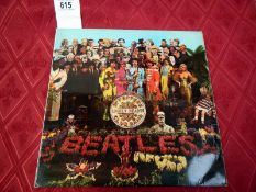 The Beatles Sgt Peppers Lonely Hearts Club Band with cutouts, G + L gatefold,