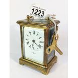 A brass carriage clock by Dyson Sons,