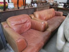 A 3 seat leather sofa and matching chair