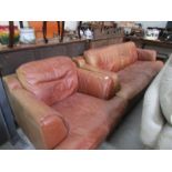 A 3 seat leather sofa and matching chair