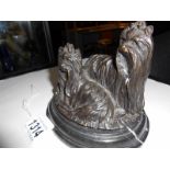 A bronze model of two Yorkshire terriers on a marble base