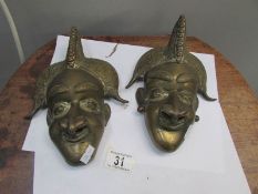 2 brass wall masks