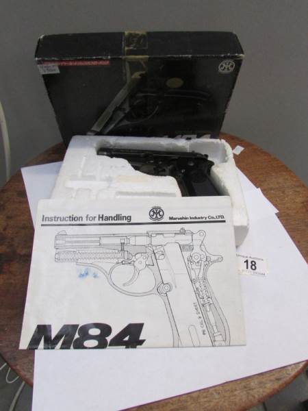 A replica metal finish M84 9mm pistol