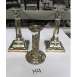 A pair of silver plated Mappin and Webb candlesticks and another candlestick a/f