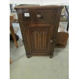 An oak Priory style bedside cabinet