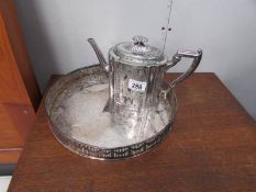 A silver plate teapot and tray