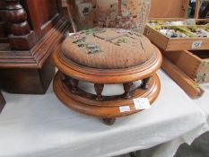 A Victorian mahogany foot stool with beaded top