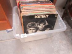 A box of LP records including The Specials, Neil Young,