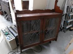 A hanging lead glazed wall cabinet