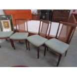 A set of 4 cane backed chairs