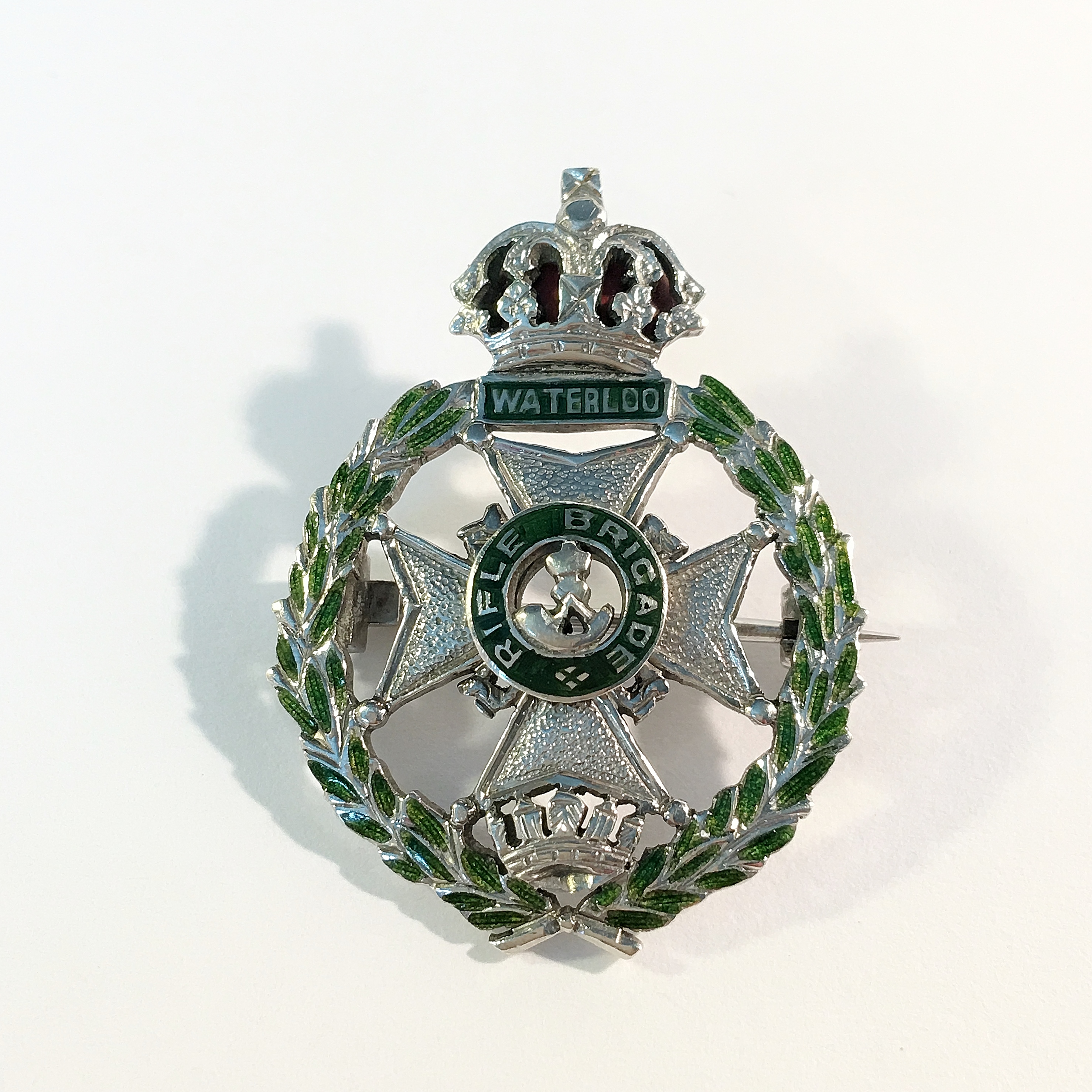 A 9ct white gold rifle brigade badge