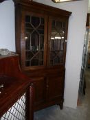 An oak astragal glazed corner cabinet