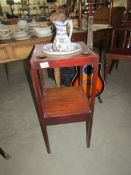 A Georgian mahogany wash stand with jug and basin