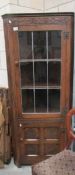 An oak corner cabinet