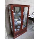 A good quality modern display cabinet with mirror back