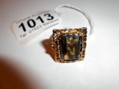 A vintage oblong ring set with smoky quartz in 9ct gold,