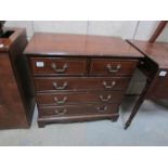 A 2 over 3 mahogany chest of drawers