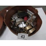 An old collar box with lighters, watches,