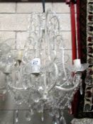 A 6 light glass chandelier