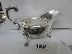 A 19th century silver sauce boat on hoof feet, London 1899,