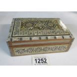 A mother of pearl inlaid box