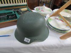 A vintage military motorcycle helmet