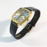 A gent's 9ct gold Omega wrist watch on leather strap