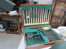 An oak cased canteen of cutlery