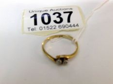 An 18ct gold and diamond 2 stone ring,