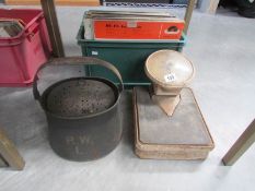 A set of vintage bathroom scales and a metal box