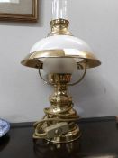 A table lamp in the form of an oil lamp