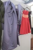 A purple gown with stole and 3 short evening/cocktail dresses