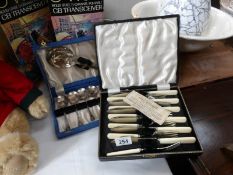 A cased set of fish knives and forks and a cased dessert set