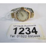 A 9ct gold (H M Chester) 1920's wrist watch on a yellow metal bracelet