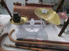 A set of kitchen scales and weights