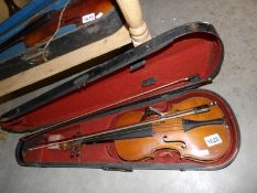 An early 19th century cased violin with 2 bows,