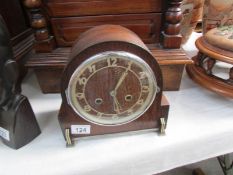 An oak mantel clock