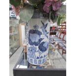 A large blue and white umbrella stand