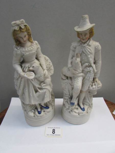 A pair of 19th century bisque figures